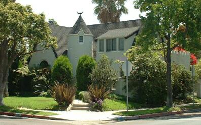 Storybook house with crennelated roofline.