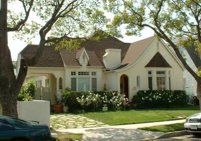 Storybook home with centrally-placed chimney.