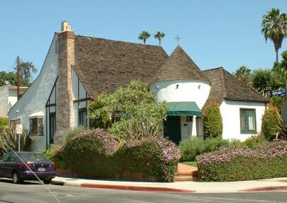 Storybook home with thick tower.